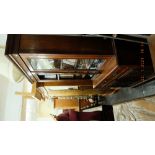 A Victorian walnut bookcase on cupboard base