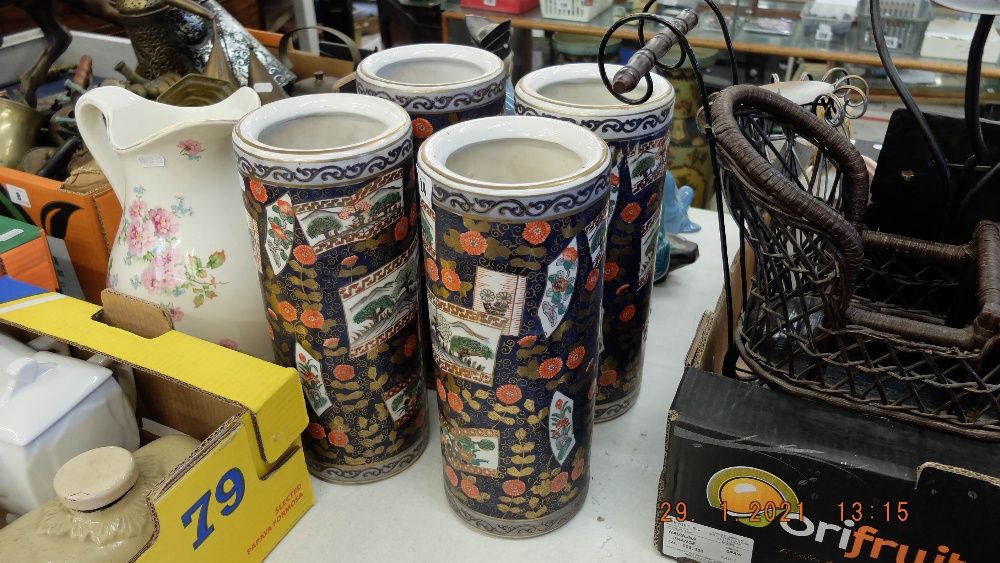 Four Imari style cylindrical vases