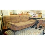 A brown hide sofa bed,