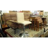 A cream leather swivel counter chair, upholstery a.