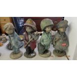 A set of four Henri Studio, signed, 'Little dreamers' statues; fire fighter, doctor,