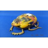 An early bronze/ glass figure of a Beetle,