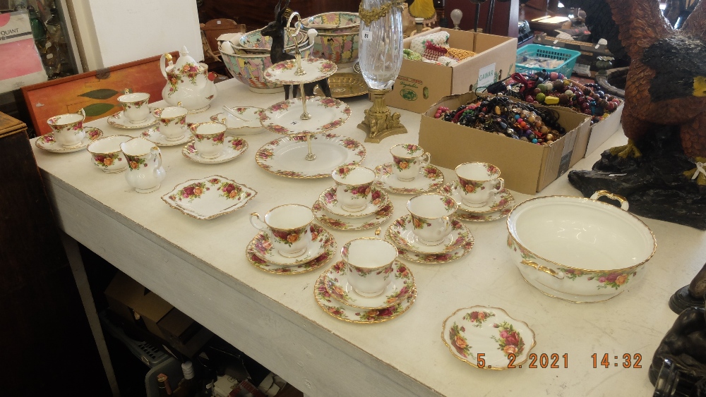 A Royal Albert tea set, thirty-three pieces inc. teapot, sugar bowl, cake stand and milk jug etc.
