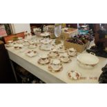 A Royal Albert tea set, thirty-three pieces inc. teapot, sugar bowl, cake stand and milk jug etc.