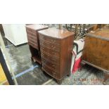 A bow front chest of six drawers