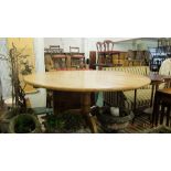 A pine pedestal breakfast table and six chairs