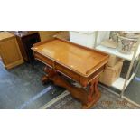 A mahogany side table with drawers