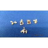 Five assorted gem set pendants