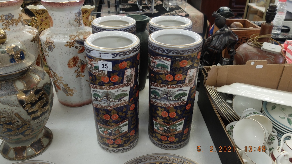 Four Imari style cylindrical vases