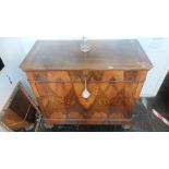 A continental Walnut chest of four drawers,