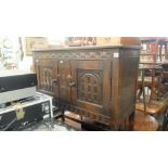 An oak two door cupboard