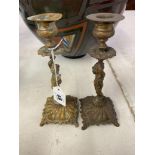 A pair of brass Cherub candlesticks