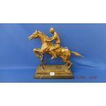 A bronze Racehorse/ Jockey statue,