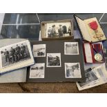 A collection of war memorabilia; OBE medal, Coronation medal, photographs inc Rommel and Montgomery,