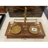 A set of brass Apothecary scales and weights in a carved box