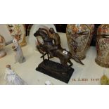 A bronze Racehorse/ Jockey statue,