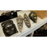 Four ethnic/ African masks