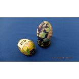 Two enamel and gilt floral decorated eggs