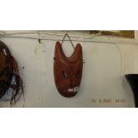 A Terracotta African mask signed Mandana inside