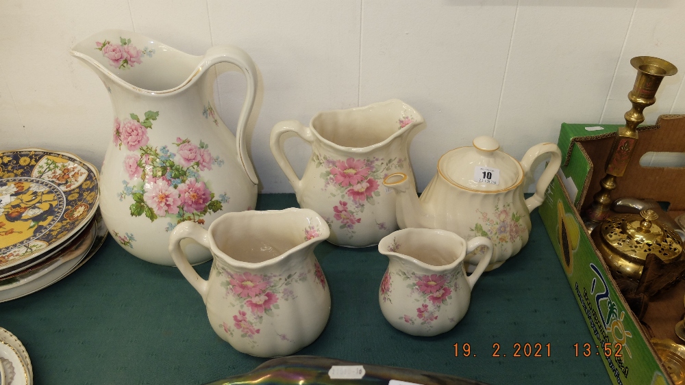 A qty of pottery jugs and a teapot