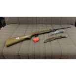 A post-war Diana model 22 air rifle and a mid century Sheffield made Bowie knife