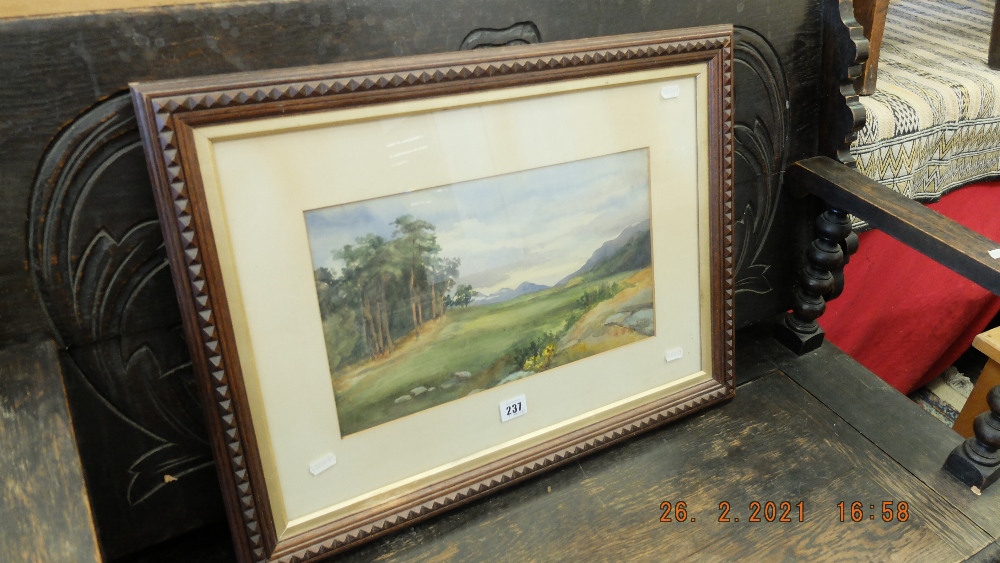 A watercolour landscape signed and dated 1901