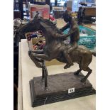 A bronze Racehorse/ Jockey statue,