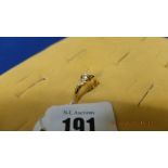 An 18ct gold diamond ring diamond centre stone and triangular diamond on shoulders