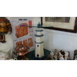 An occasional table in form of a lighthouse
