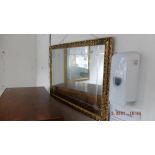 A gilt framed mirror,