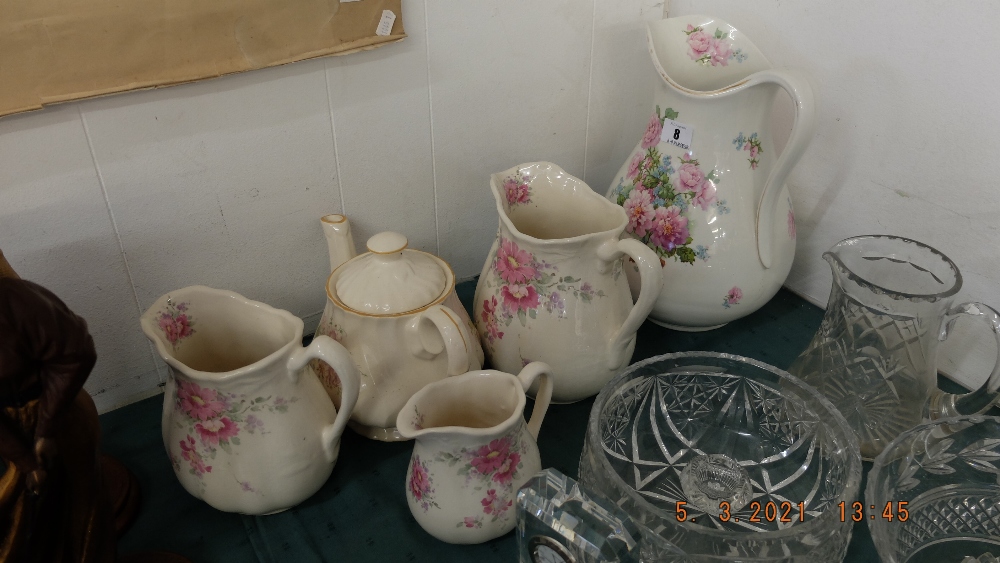 A qty of pottery jugs and a teapot