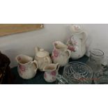 A qty of pottery jugs and a teapot