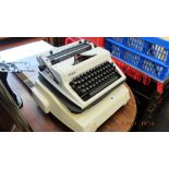 An electric typewriter and a portable typewriter