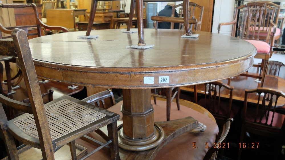 A 19th century mahogany breakfast table