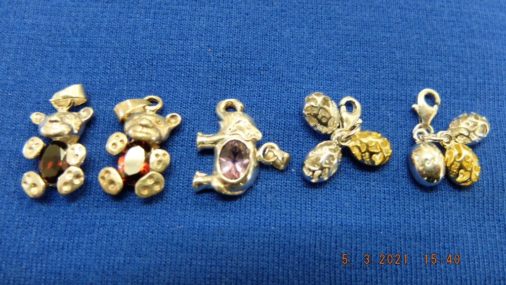 Five assorted gem set pendants
