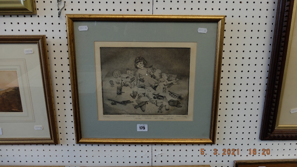 A framed etching of a child with toys dated 86