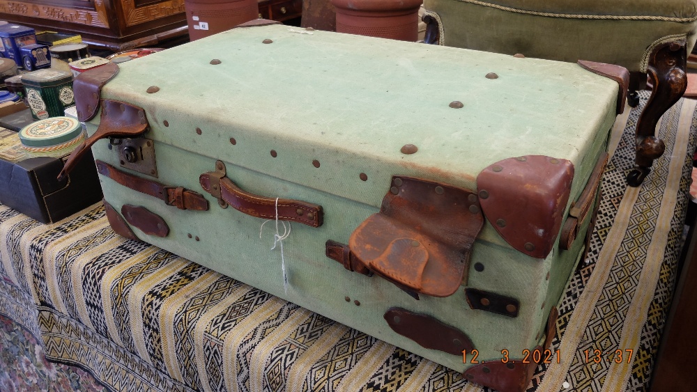 A leather bound cabin trunk