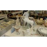 A qty of Lladro and a Royal Doulton figure