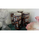 Four Imari style cylindrical vases