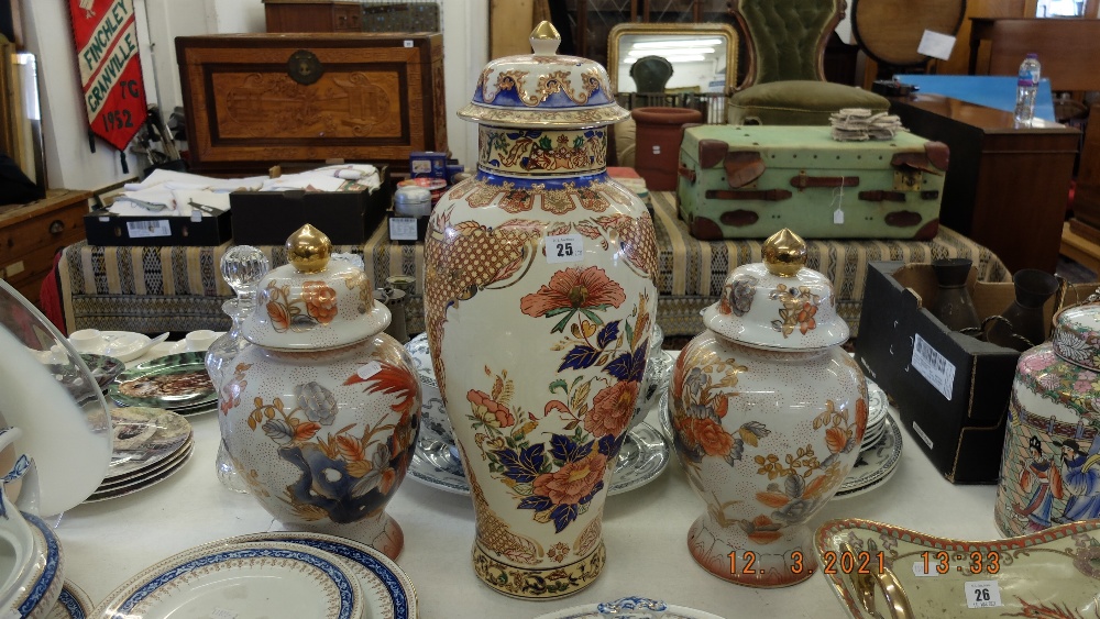 A pair of Orange and white temple jars plus a larger lidded temple jar