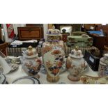 A pair of Orange and white temple jars plus a larger lidded temple jar