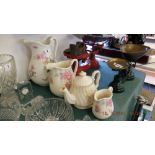 A qty of pottery jugs and a teapot