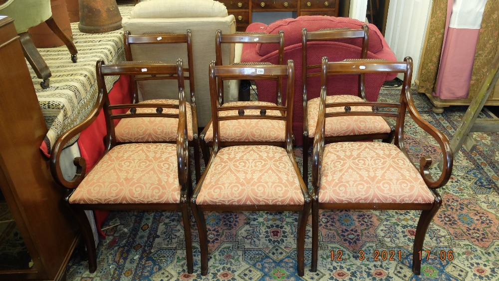 A set of six Regency style chairs plus two carvers