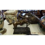 A bronze Racehorse/ Jockey statue,