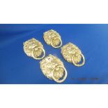 Four silvered Lion door knockers