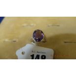 An 18ct gold Amethyst and diamond ring, 11.