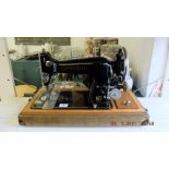 A Harris electric sewing machine in case