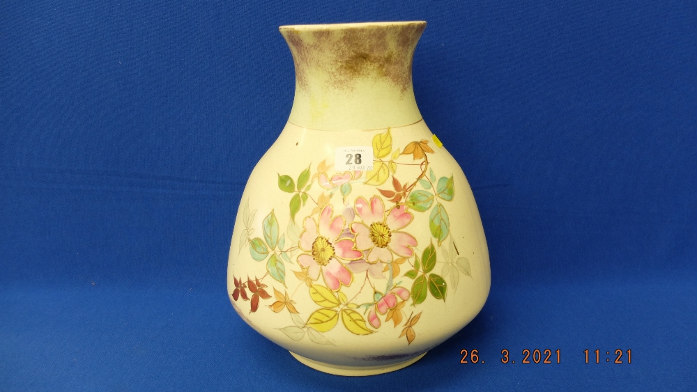 A floral decorative vase marked T.E.M.