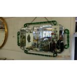 A unusual mid century decorative mirror