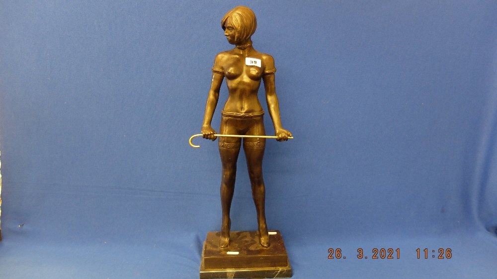 A bronze lady with cane